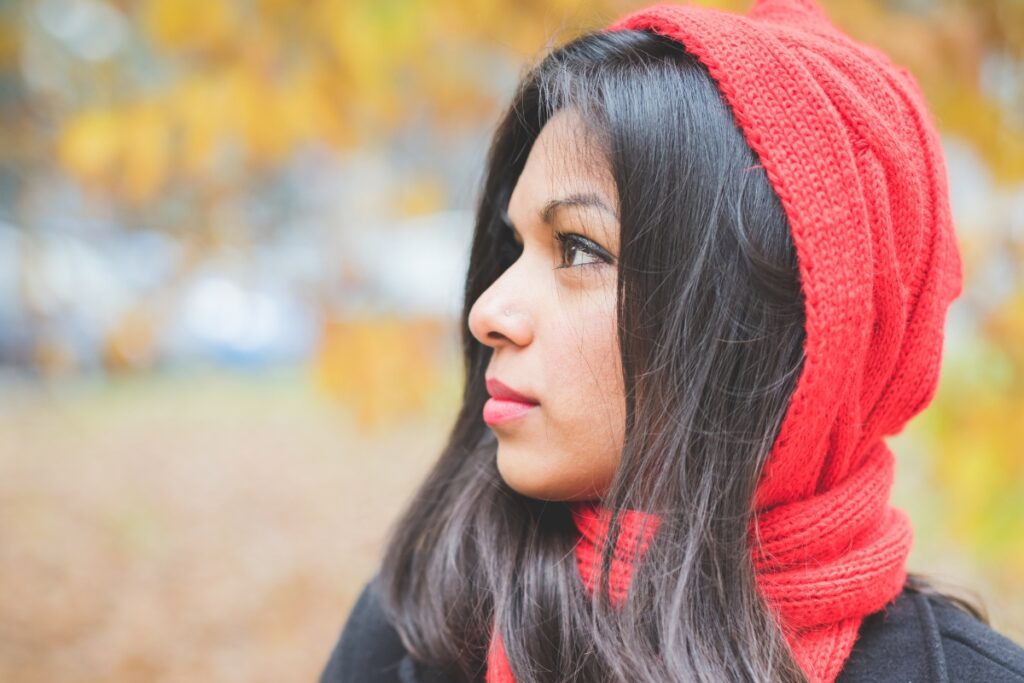 Scorpio woman outside in autumn leaves