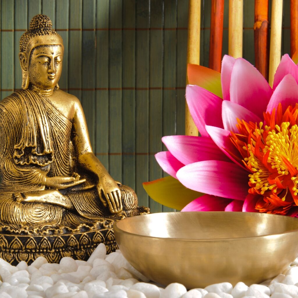 Buddha statue, meditation bowl, lotus flower