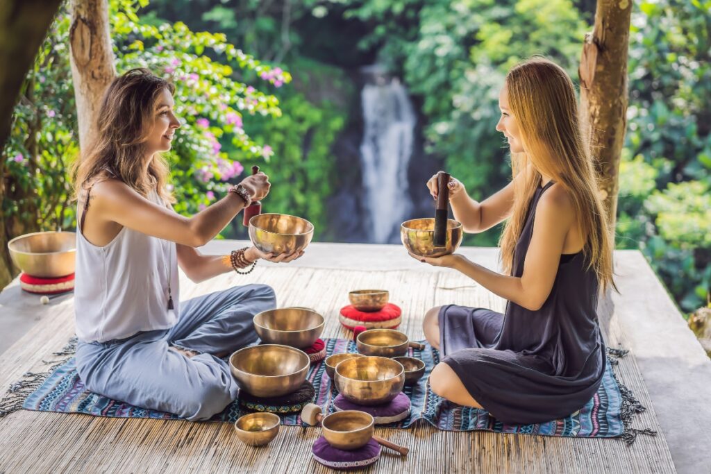 Spiritual women with Tibetan singing bowls for New Year's