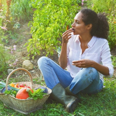 Woman eating a freshly picked strawberry
