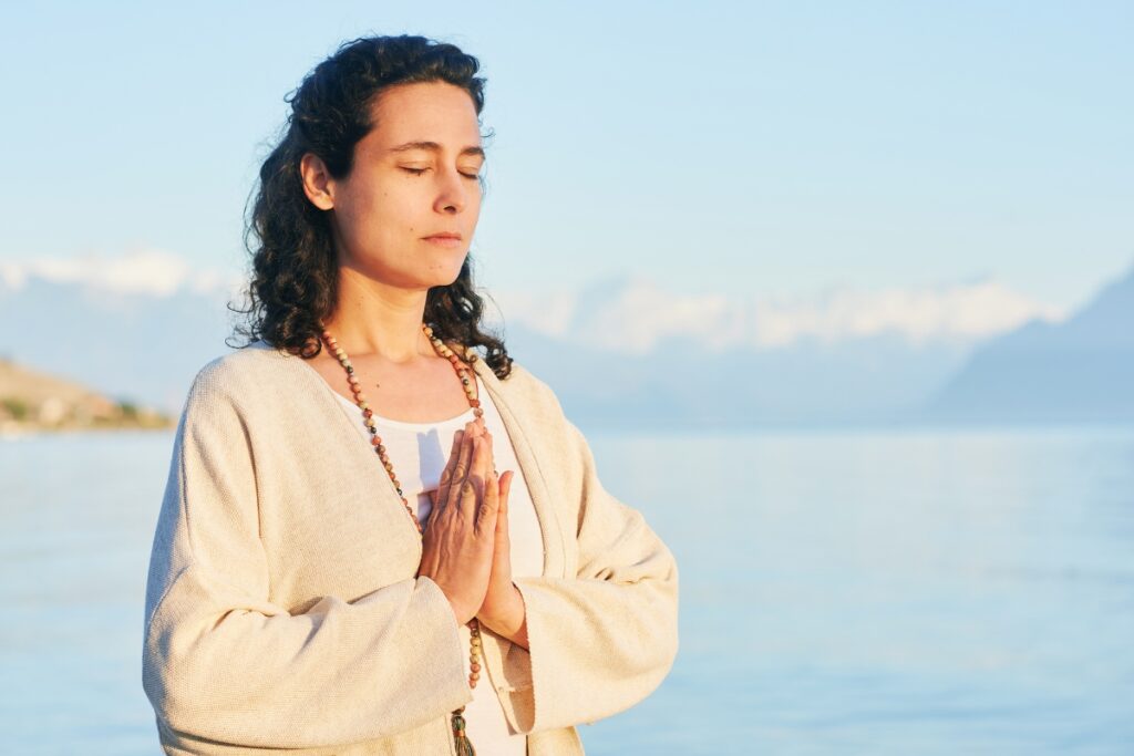 Woman meditating and practicing Marissa Peer's DICCC Method