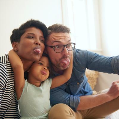 Family having fun taking a picture, being silly and authentic