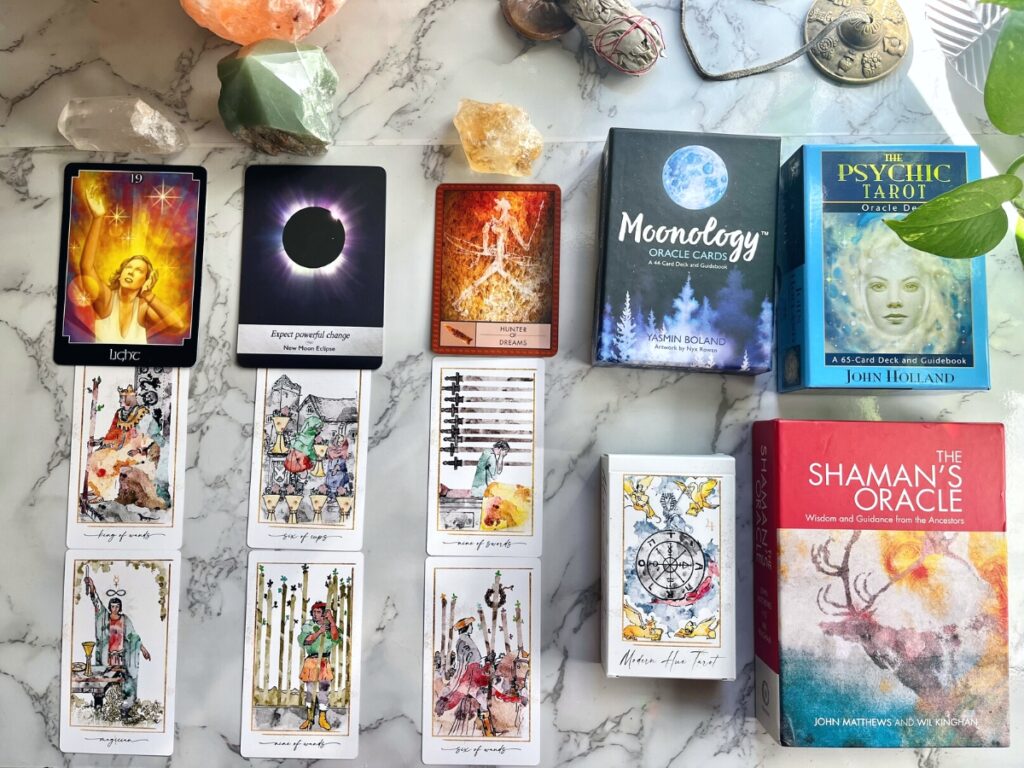 Sample New Year's Tarot Reading with columns, using Moonology deck, Shaman's Oracle, Psychic Tarot, and Modern Hue Rider-Waite