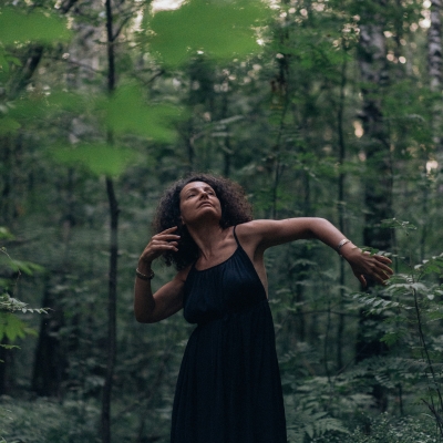 Woman dancing in the forest