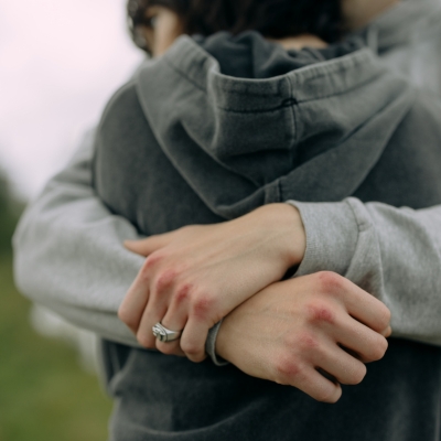 Young man and young woman hugging