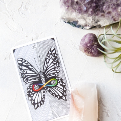 A butterfly card (Two of Pentacles) from the Wild Unknown Tarot