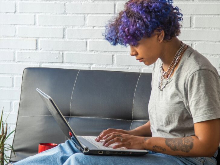 Neurodivergent woman hyperfocused on her computer at home